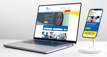 A laptop and mobile phone showing the homepage of Sussex Partnership's new website