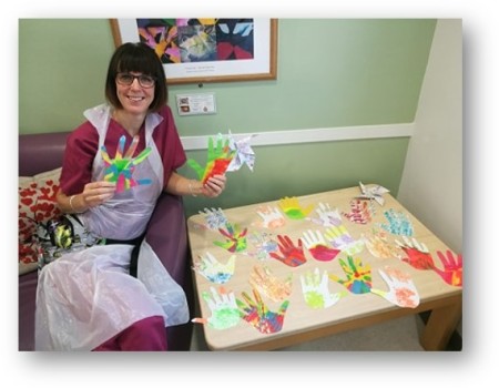 jodie_ide_occupational_therapist_at_sussex_partnership_nhs_foundation_trust_with_the_hand_art.jpg