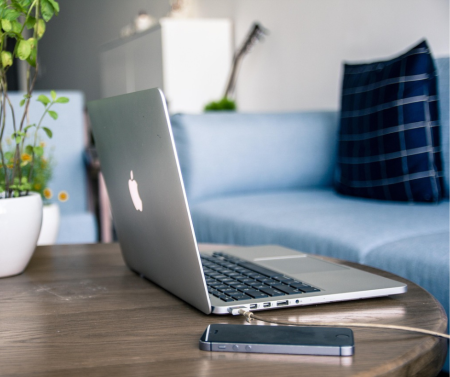 Image of laptopon a table in a living room.png