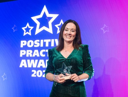 Lucy Morley, Lead Family Ambassador collecting the award for the Family Ambassador team